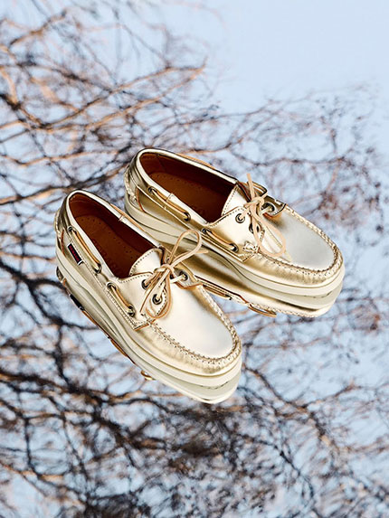 SEBAGO Pair of gold docksides moccasins placed on a mirror